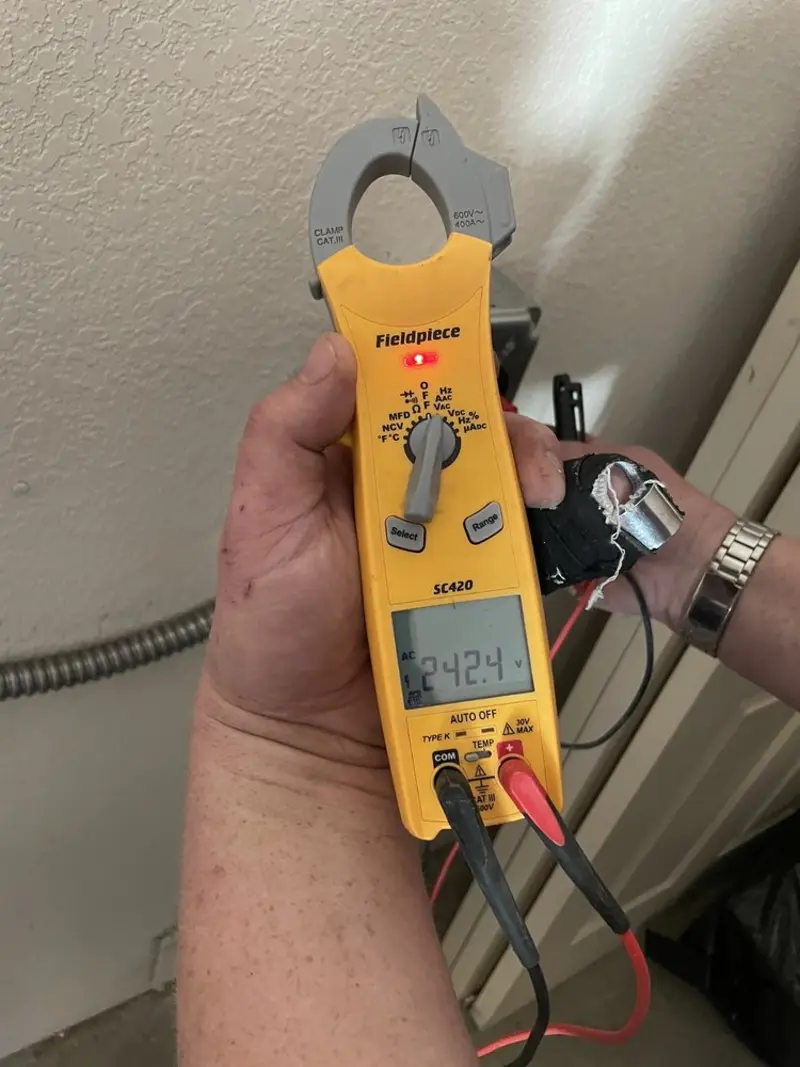 Voltage testing with clamp meter during Ceiling Fan Installation in Lake Havasu City